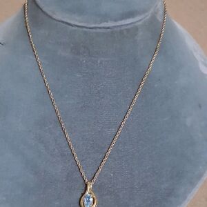 Elegant Gold Necklace with Blue Gemstone